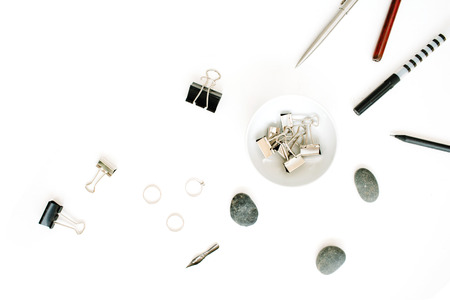 Flat lay, top view office table desk. Feminine workspace with pen, pencil and clipsの写真素材