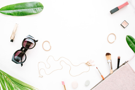 female summer bikini swimsuit and accessories collage on white with palm branches, necklace and sunglasses. flat lay, top viewの写真素材