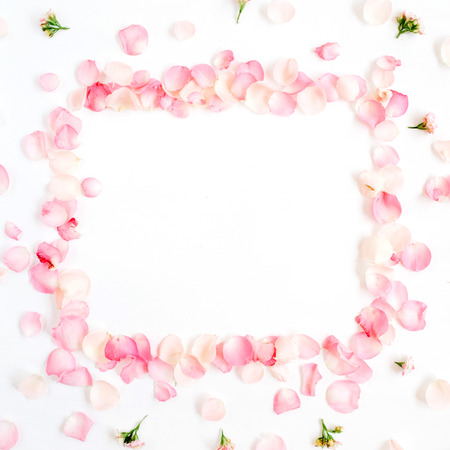 Frame made of pink roses petals on white background. Flat lay, top view. Valentine's backgroundの写真素材