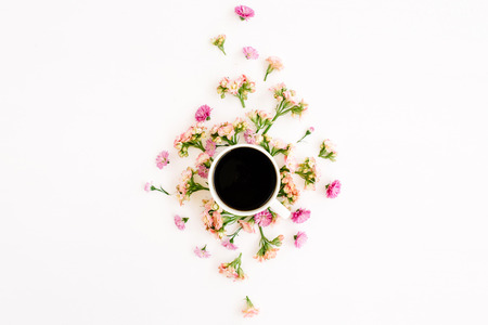 Coffee cup and floral composition with wildflowers. Flat lay, top viewの写真素材