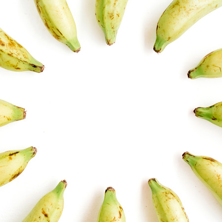 Round frame made of bananas. Flat lay, top view. Creative food conceptの写真素材