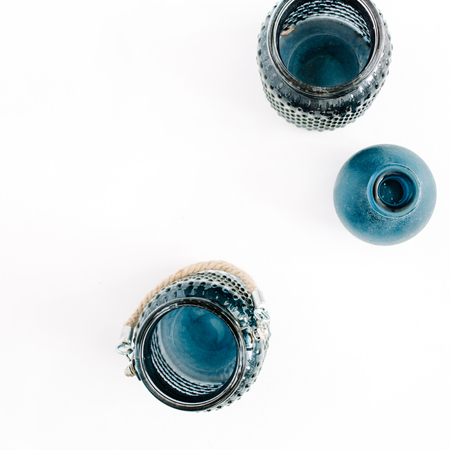 Three blue stylish jars on white background. Top view minimal decoration concept.の写真素材