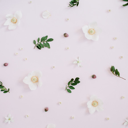 Floral pattern with flower buds, green leaves, branches. Flat lay, top view background.の写真素材