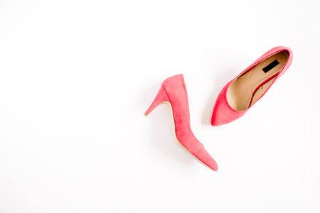 Beauty blog concept. Red female shoes on white background. Flat lay, top view trendy fashion feminine background.の写真素材