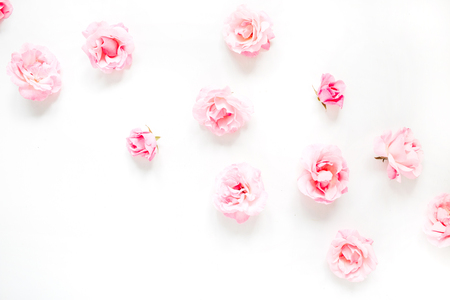 Pink rose buds pattern on white background. Flat lay, top view. Valentine's background. Pattern of flowers.の写真素材
