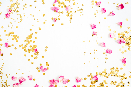 Mock up frame made of pink rose petals and golden confetti on white background. Flat lay, top view.の写真素材