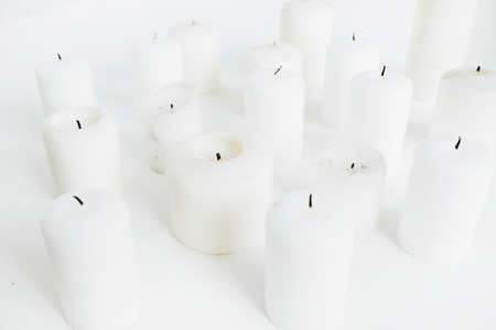 Candles set on white background.の写真素材