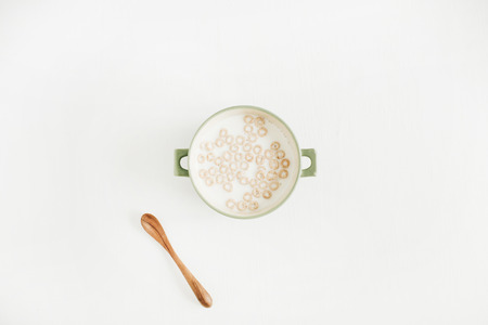 Cereals with milk on white background. Flat lay, top view.の写真素材