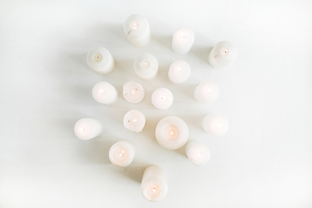 Candles set on white background. Flat lay, top view.の写真素材