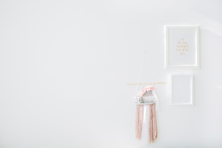 Minimal interior design concept. White wall, photo frames and decoration.の写真素材