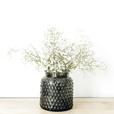 White gypsophila flowers bouquet in flowerpot at white background.の写真素材