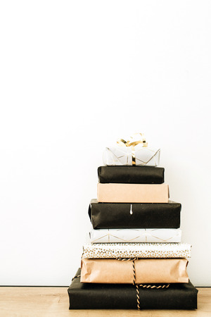 Christmas / New Year presents stack on white background. Minimal holiday composition.の写真素材