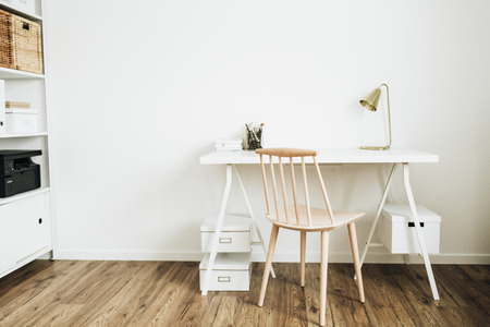Nordic modern minimal interior design concept. Desktop table and wooden chair in white room.の写真素材
