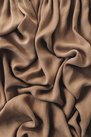 Brown silk crumpled linen texture pattern. Closeup textile background.の写真素材