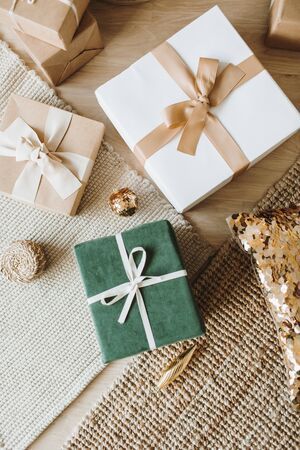 Christmas / New Year gift boxes with bows. Traditional winter holidays gifts packaging creative...