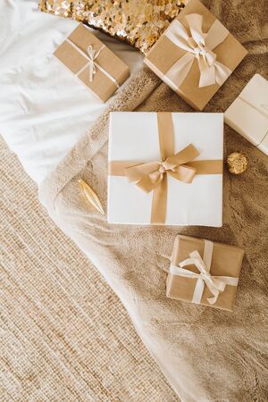 Christmas / New Year gift boxes with bows. Winter holidays gifts packaging concept. Flat lay, top...