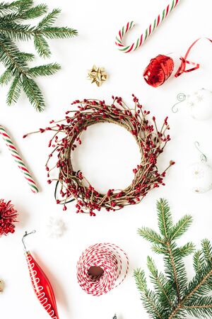 Christmas / New Year composition. Mockup frame wreath with copy space, fir branches, Christmas baubles, decorations on white background. Flat lay, top view holiday concept.`の写真素材