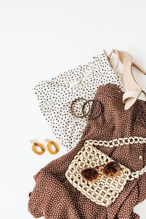 Fashion collage with women's clothes and accessories on white background. Flat lay, top view lifestyle fashion beauty blog concept.の写真素材