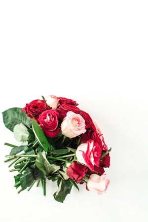 Pink and red rose flowers bouquet isolated on white background. Flatlay, top view holiday, Valentine's day present.の写真素材