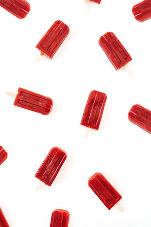 Red ice-cream pattern on white background. Flat lay, top view.の写真素材