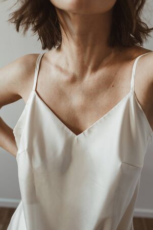 Closeup of young beautiful woman in silk underwear. Fashion concept.