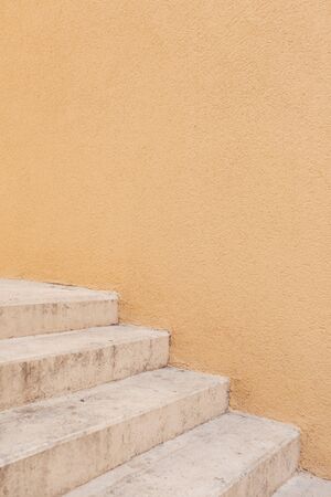 Minimal architecture concept. Yellow wall with white stairs. Neutral minimal background.の写真素材