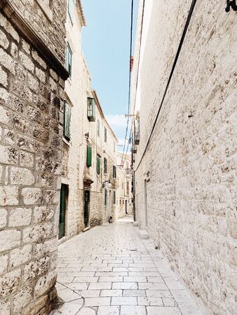 Travel summer concept. Old city view of Europe, Croatia, Sibenik. Empty street with old buildings...