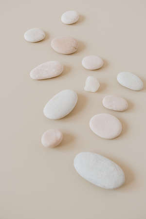Pale pastel stones on neutral stones. Spa concept.の写真素材