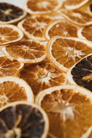 Slices of dry oranges. Raw citrus fruits pattern background.の写真素材