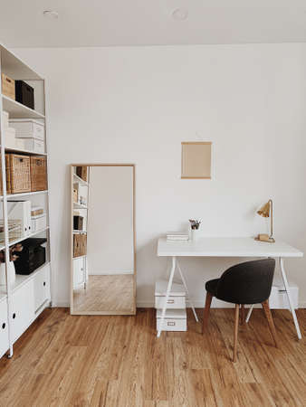 Modern nordic interior design concept. Scandinavian home office, minimal workspace. Business study cabinet. Girl boss studio concept.の写真素材