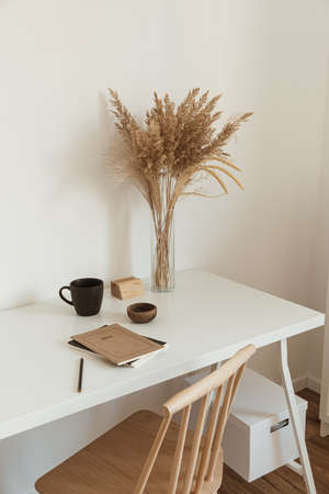 Minimalist home office workspace. Light aesthetic hygge space. Modern interior design.の写真素材