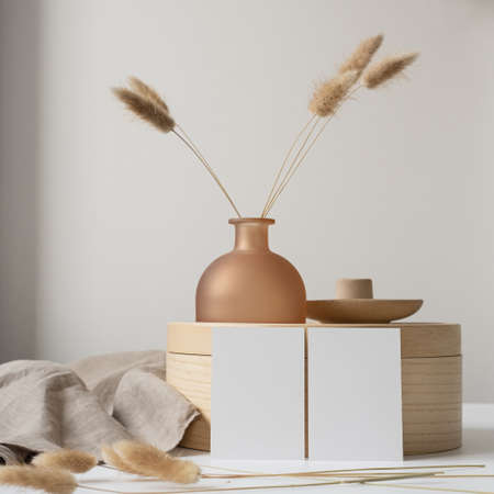 Blank paper cards with mockup copy space, bunny tail grass, wooden tray, neutral beige blanket. Aesthetic business templateの写真素材