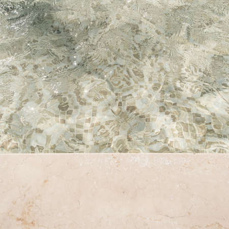 Beautiful view of swimming pool side with clear blue water with sunlight shadow wave reflections. Minimal aesthetic summer vacation concept backgroundの写真素材