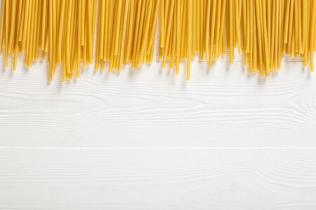 Dried pasta selection on wooden white background. Top view.の写真素材