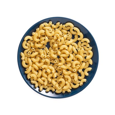 Uncooked pasta in plate isolated on white backgroundの写真素材