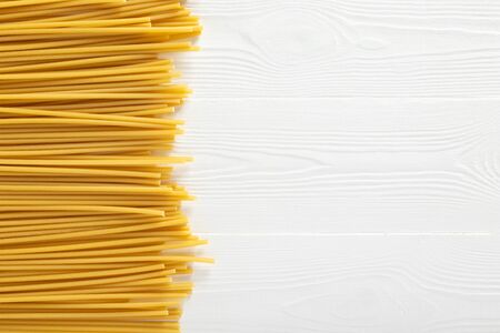 Dried pasta selection on wooden white background. Top view.の写真素材