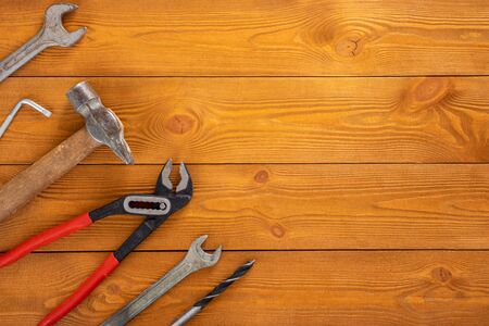 Top view layout of tools for repair on wooden background, free space for textの写真素材