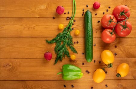 Vegetables on wooden table, top view, healthy food concept, copy spaceの写真素材