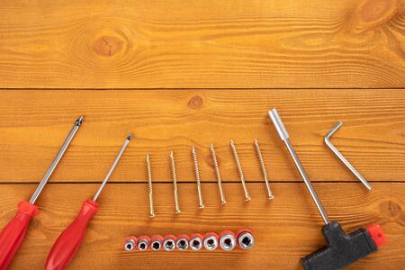 Top view layout of tools for repair on wooden background, free space for textの写真素材