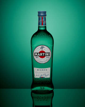 Moscow, Russia - APRIL 27, 2020: Bottle of Martini Bianco on green background with reflectionのeditorial素材