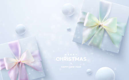 Merry Christmas and Happy New Year. White gift boxes with crossing ribbons and bows on white background with snow balls. Vector holiday 3d illustration. Christmas decoration with snowflakes overlay.のイラスト素材