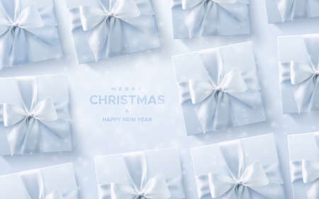 Merry Christmas and Happy New Year. White gift boxes with crossing ribbons and bows on white background. Vector holiday 3d illustration. Christmas decoration with snowflakes overlay. Top viewのイラスト素材