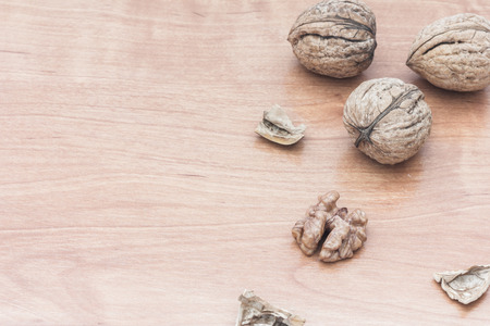 Fresh walnuts on wooden backgroundの写真素材