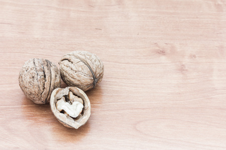 Fresh walnuts on wooden backgroundの写真素材