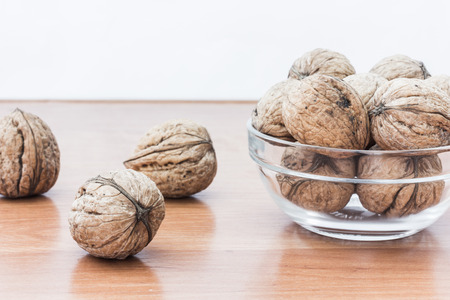 Fresh walnuts on wooden background