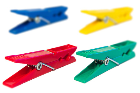 Colored clothespins on a white backgroundの写真素材