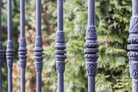 Elements of black metallic forged fence with spikes.の写真素材