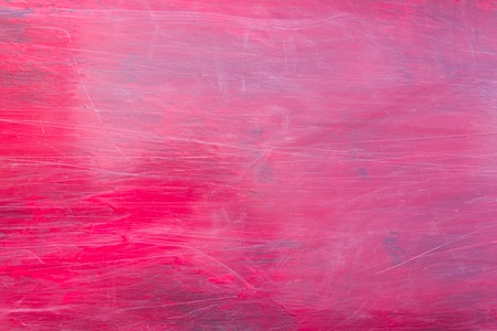 Red scratched metal plate. Abstract red backgroundの写真素材