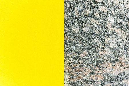 Two-color abstract background. Part yellow and part marble. Texture of natural marble background. Patternの写真素材