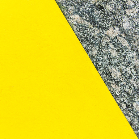 Two-color abstract background. Part yellow and part marble. Texture of natural marble background. Patternの写真素材